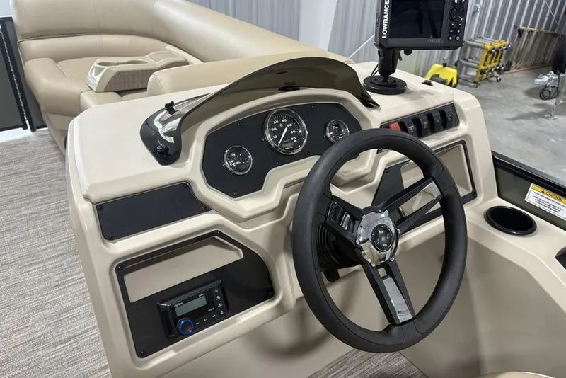 Slide: The Image of 2025 Godfrey Xperience 2286 SBX boat dashboard with steering wheel and control panel. - 4