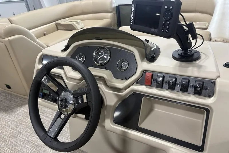Slide: The Image of Steering console of 2025 Godfrey Xperience 2286 SBX with Lowrance display and controls. - 7