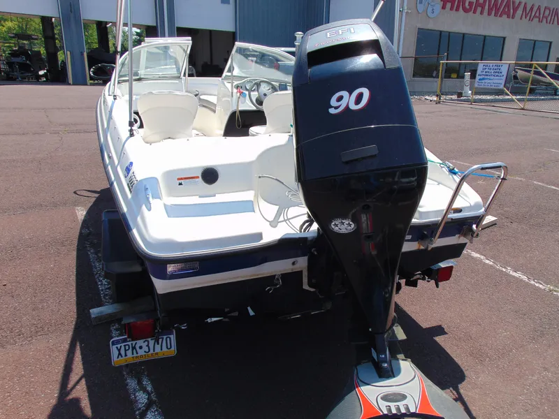 Slide: The Image of 2010 Bayliner 160 Bowrider with 90 HP engine, parked at a marina. - 6