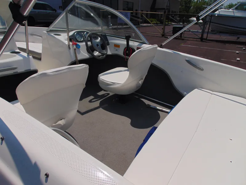 Slide: The Image of 2010 Bayliner 160 Bowrider interior with steering wheel and seating. - 8