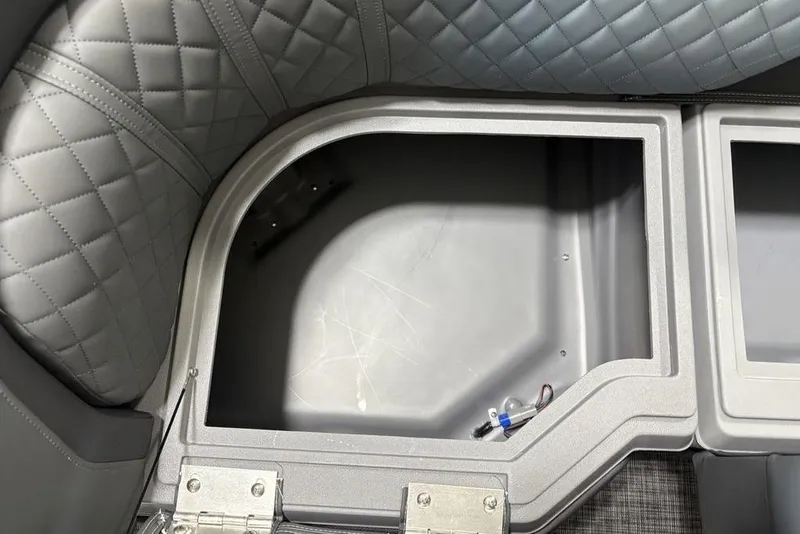 Slide: The Image of Interior storage compartment of 2025 Godfrey Sweetwater 2286 SFL boat with quilted upholstery. - 10