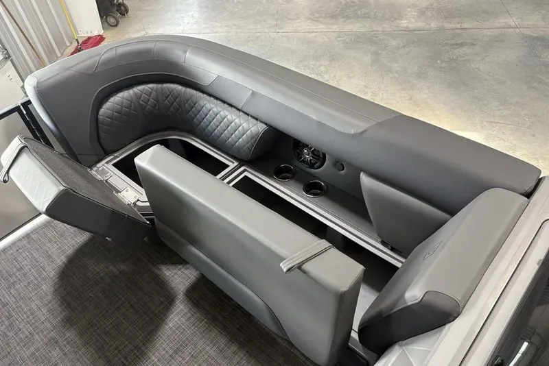 Slide: The Image of Luxurious seating in 2025 Godfrey Sweetwater 2286 SFL pontoon boat, featuring storage and cup holders. - 12