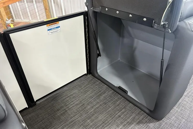 Slide: The Image of Open storage compartment in 2025 Godfrey Sweetwater 2286 SFL pontoon boat. - 13