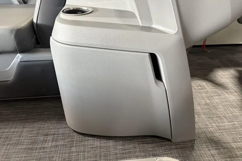 Slide: The Image of 2025 Godfrey Sweetwater 2286 SFL boat interior, featuring sleek seating and cup holder. - 19