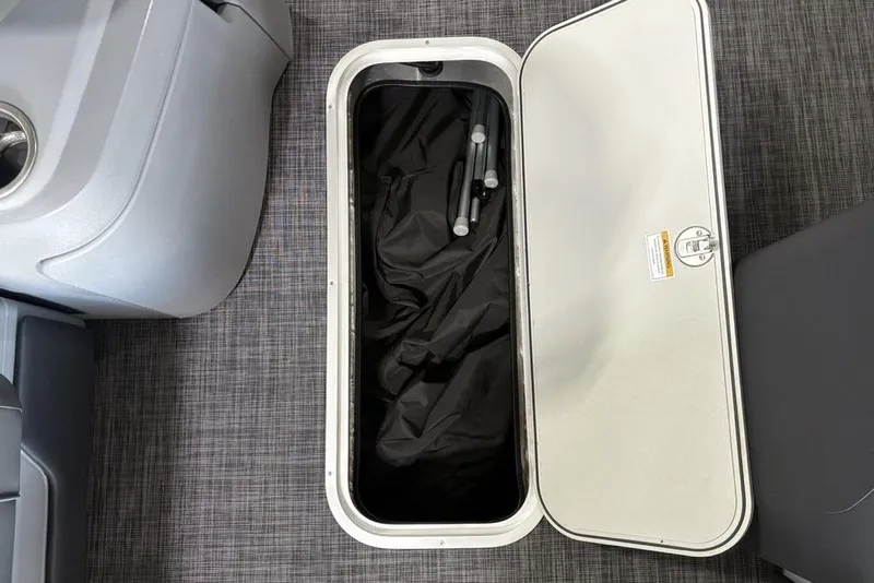 Slide: The Image of Open storage compartment in 2025 Godfrey Sweetwater 2286 SFL boat, showcasing interior space. - 20