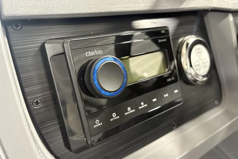 Slide: The Image of Clarion audio system in 2025 Godfrey Sweetwater 2286 SFL boat dashboard. - 24
