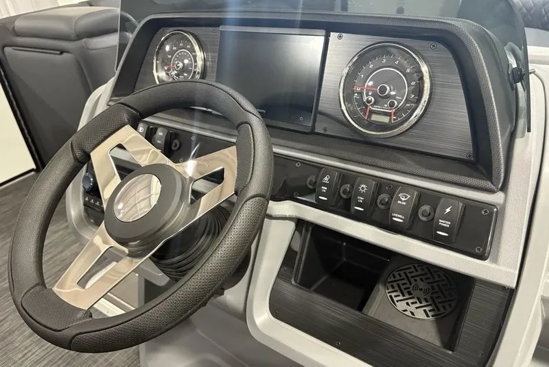 Slide: The Image of Steering console of 2025 Godfrey Sweetwater 2286 SFL with modern controls and gauges. - 25