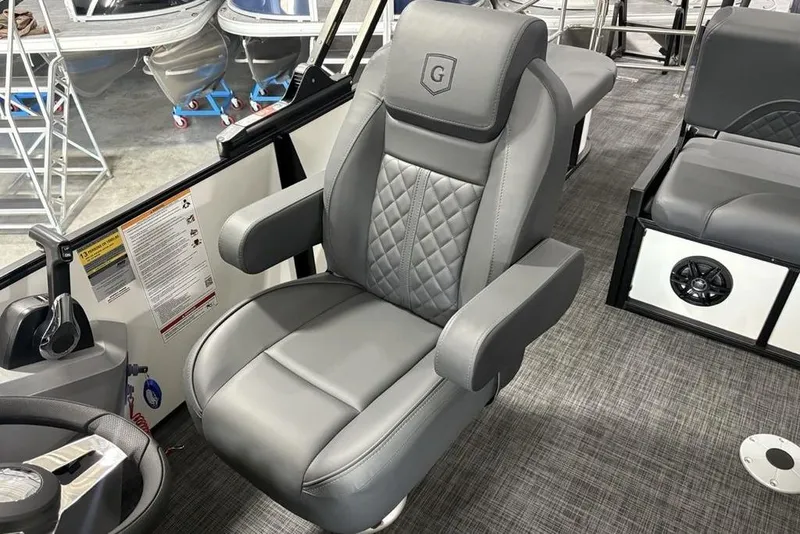Slide: The Image of Luxurious seating in 2025 Godfrey Sweetwater 2286 SFL boat, featuring quilted gray upholstery. - 26