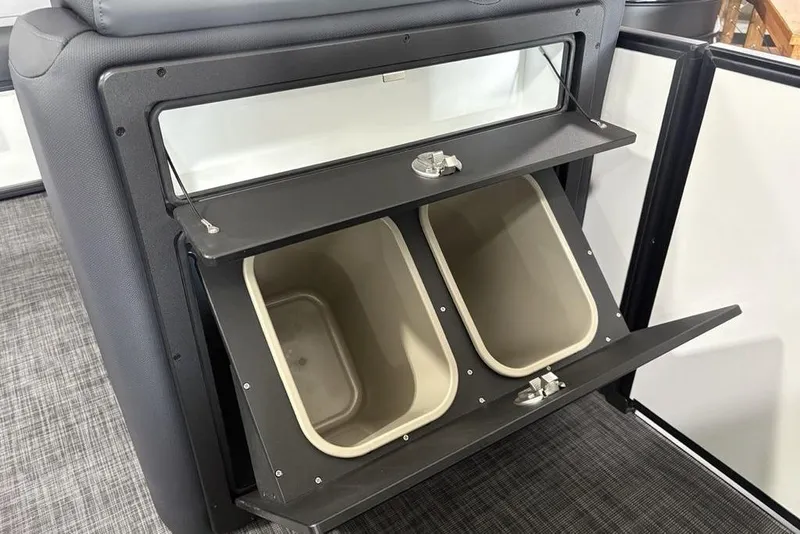Slide: The Image of Storage compartment with dual bins in 2025 Godfrey Sweetwater 2286 SFL boat. - 27