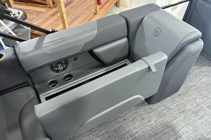 Slide: The Image of 2025 Godfrey Sweetwater 2286 SFL boat interior with gray seating and cup holders. - 30