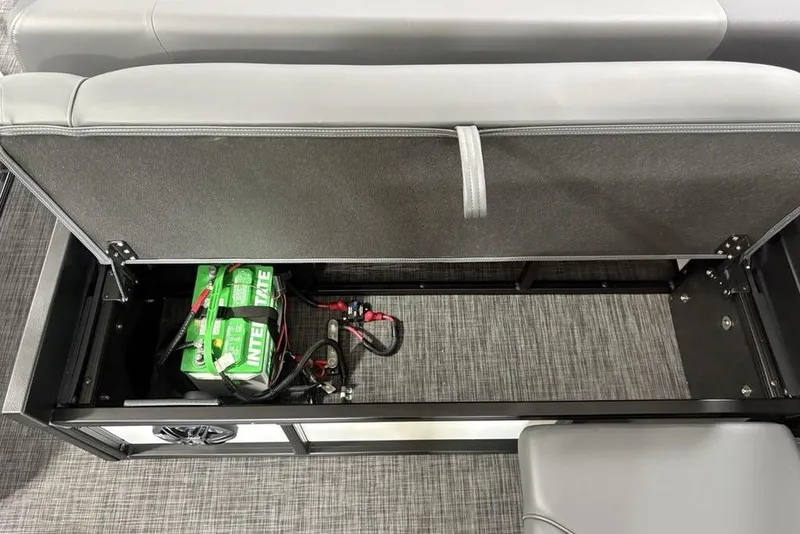 Slide: The Image of 2025 Godfrey Sweetwater 2286 SFL boat storage compartment with battery and wiring. - 37