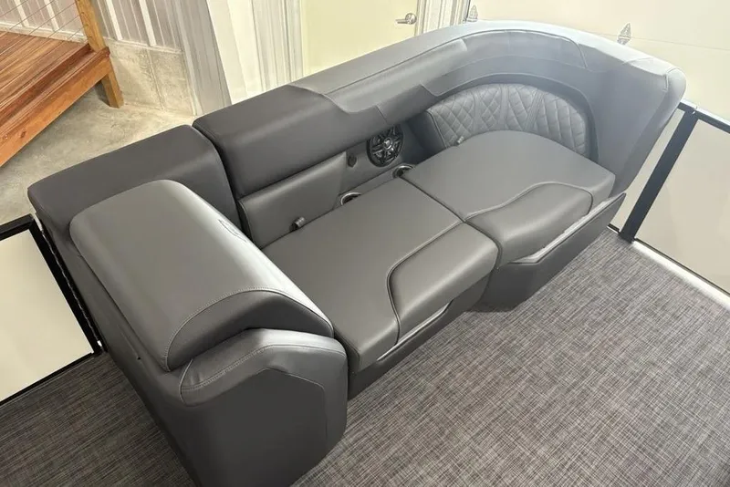 Slide: The Image of Luxurious seating on 2025 Godfrey Sweetwater 2286 SFL pontoon boat, featuring sleek gray upholstery. - 7