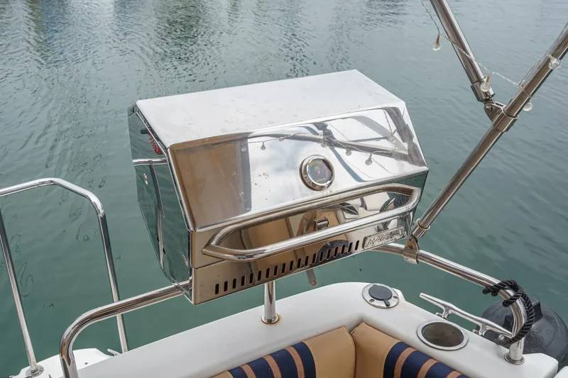 Slide: The Image of Stainless steel grill on 2014 Cutwater C-30 SC LE boat, docked on calm water. - 15