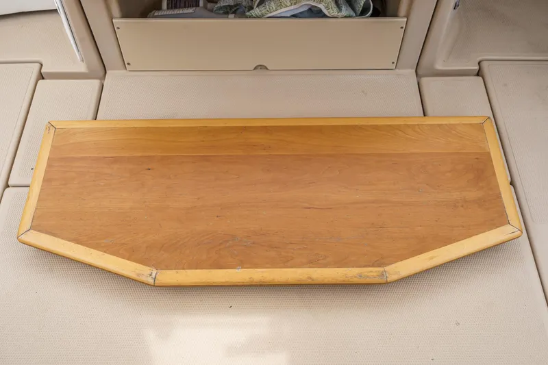 Slide: The Image of Wooden table on a 2014 Cutwater C-30 SC LE boat deck. - 16