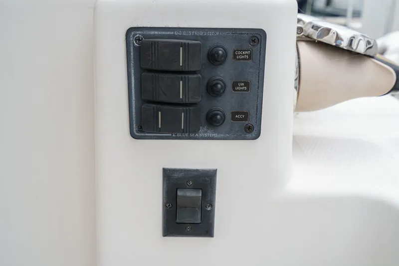 Slide: The Image of Control panel on 2014 Cutwater C-30 SC LE boat, featuring switches and buttons. - 21