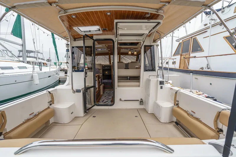 Slide: The Image of 2014 Cutwater C-30 SC LE boat interior with seating and open cabin view. - 22