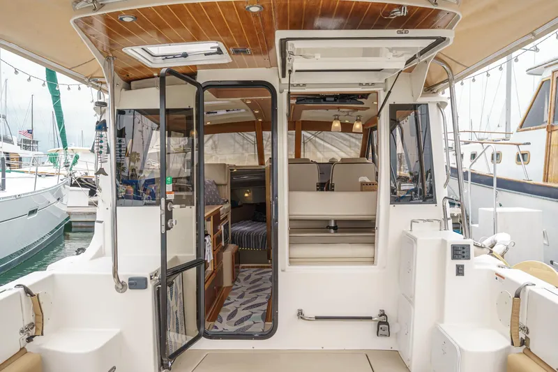 Slide: The Image of 2014 Cutwater C-30 SC LE boat interior with open doors and seating area. - 23