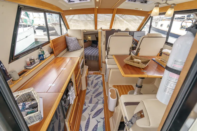 Slide: The Image of Luxurious 2014 Cutwater C-30 SC LE yacht interior with wood finishes and modern amenities. - 25