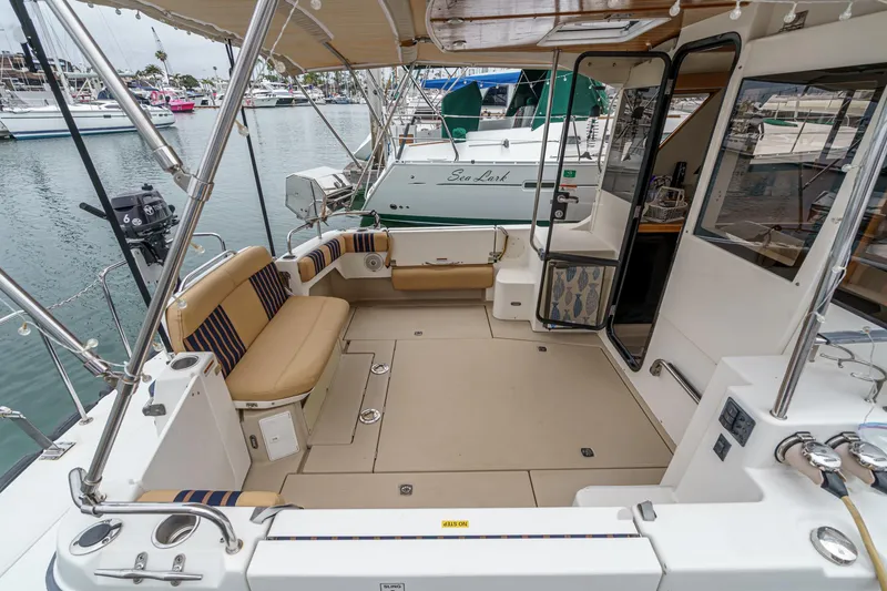 Slide: The Image of 2014 Cutwater C-30 SC LE boat interior with seating, docked at marina. - 3
