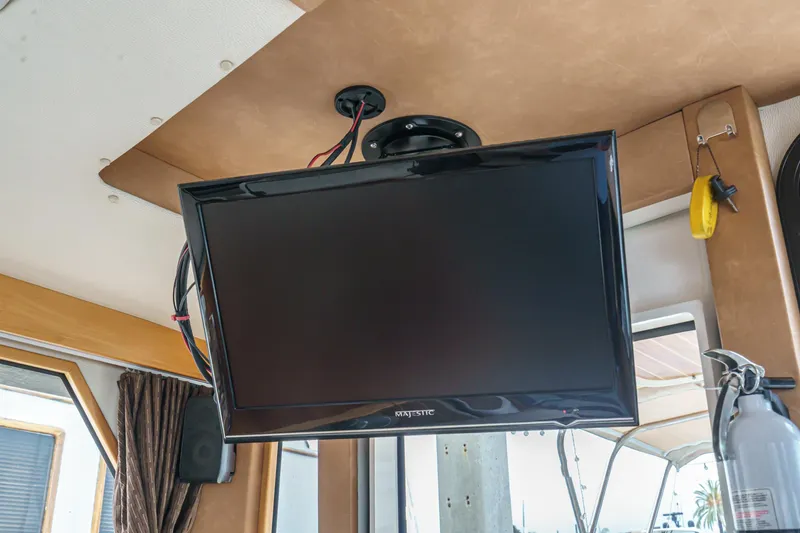 Slide: The Image of Ceiling-mounted TV inside 2014 Cutwater C-30 SC LE boat interior. - 33