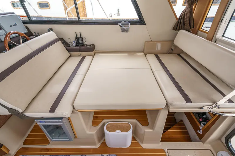 Slide: The Image of Interior of 2014 Cutwater C-30 SC LE boat with convertible seating and wooden flooring. - 34