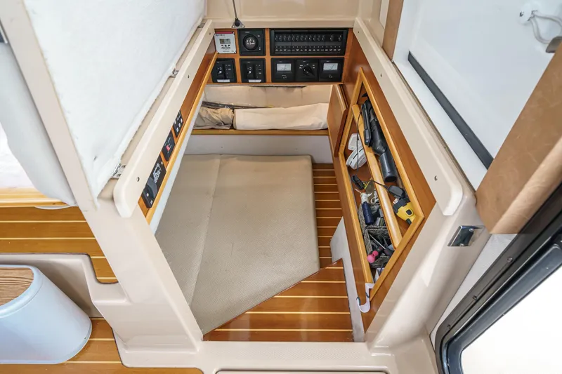 Slide: The Image of 2014 Cutwater C-30 SC LE cabin interior with control panels and storage compartments. - 35