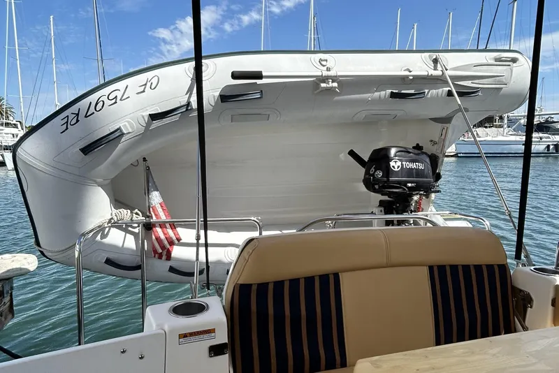 Slide: The Image of 2014 Cutwater C-30 SC LE with dinghy and Tohatsu motor in marina setting. - 8