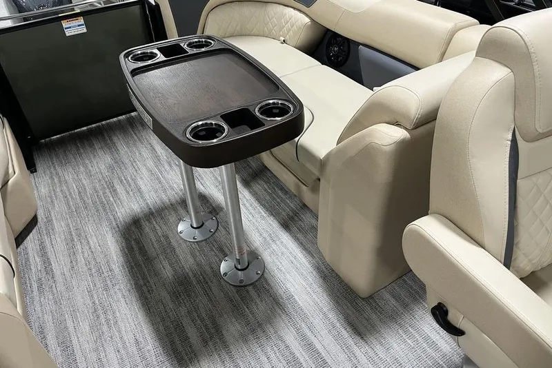 Slide: The Image of Luxurious interior of 2025 Godfrey Sweetwater 2286 SB pontoon with elegant seating and table. - 10