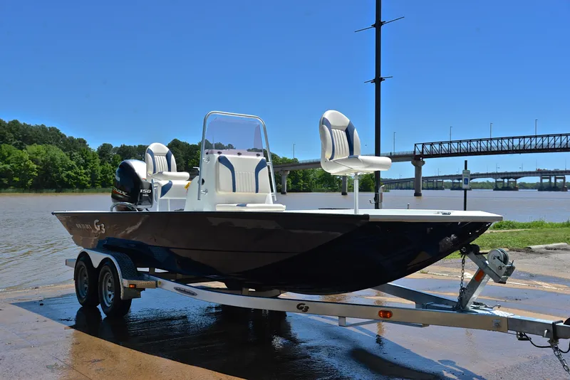 Slide: The Image of 2019 G3 Bay 20 DLX boat on trailer by river, sunny day. - 16