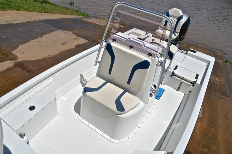 Slide: The Image of 2019 G3 Bay 20 DLX boat with seating and console, docked by the water. - 25