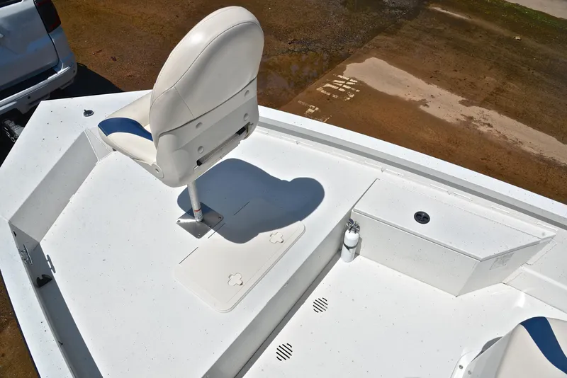 Slide: The Image of 2019 G3 Bay 20 DLX boat deck with white seating and storage compartments. - 26