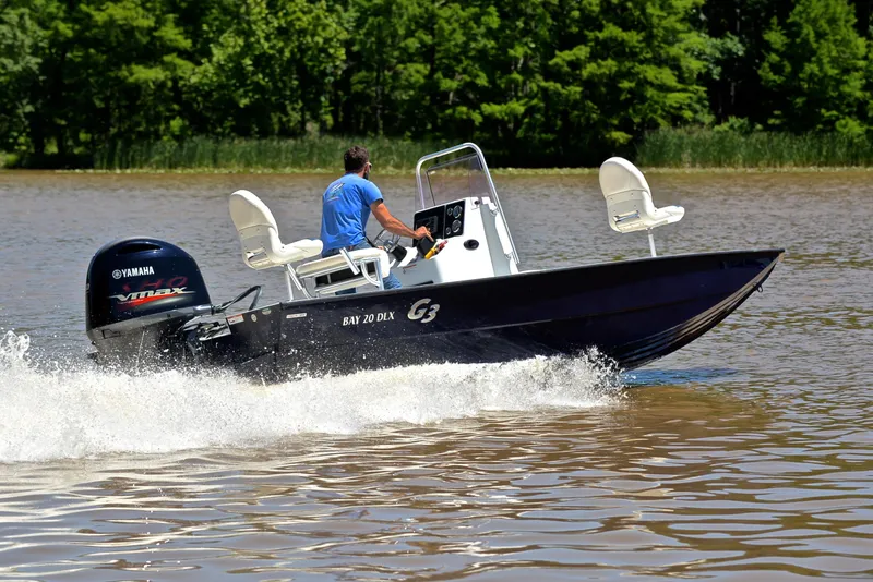 Slide: The Image of 2019 G3 Bay 20 DLX boat cruising on a lake with Yamaha engine. - 5