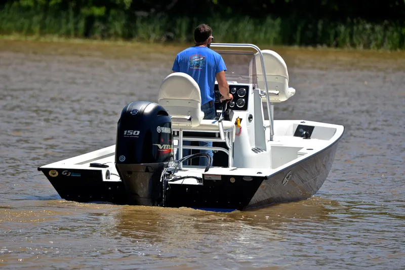 Slide: The Image of 2019 G3 Bay 20 DLX boat on water, rear view with Yamaha engine. - 8