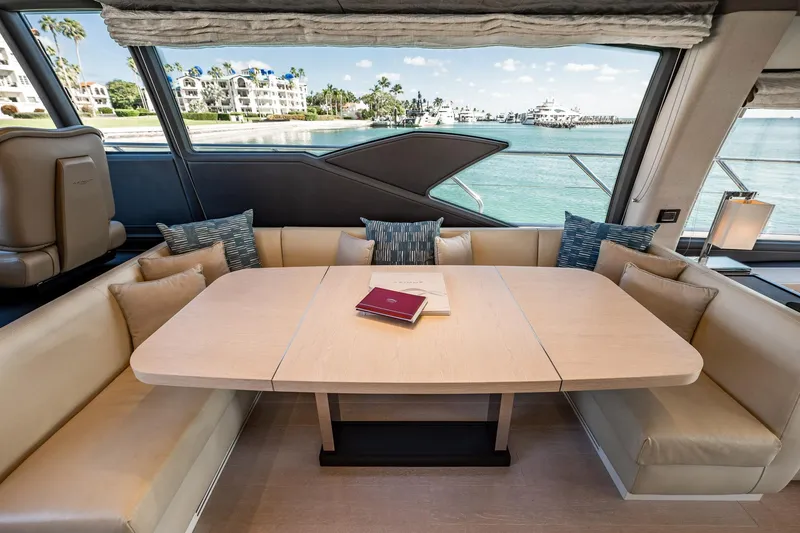 Slide: The Image of Luxurious interior of 2017 Azimut 66 yacht with elegant dining area and scenic ocean view. - 10