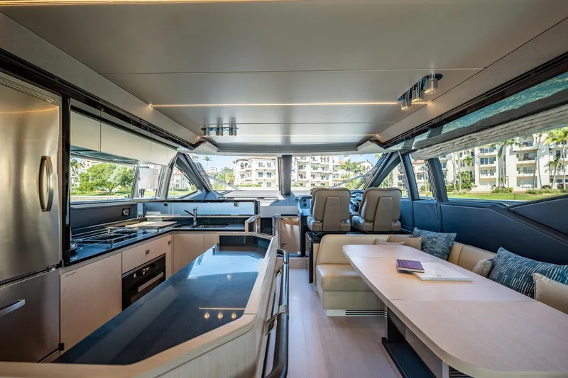 Slide: The Image of Luxurious interior of a 2017 Azimut 66 yacht with modern kitchen and seating area. - 12