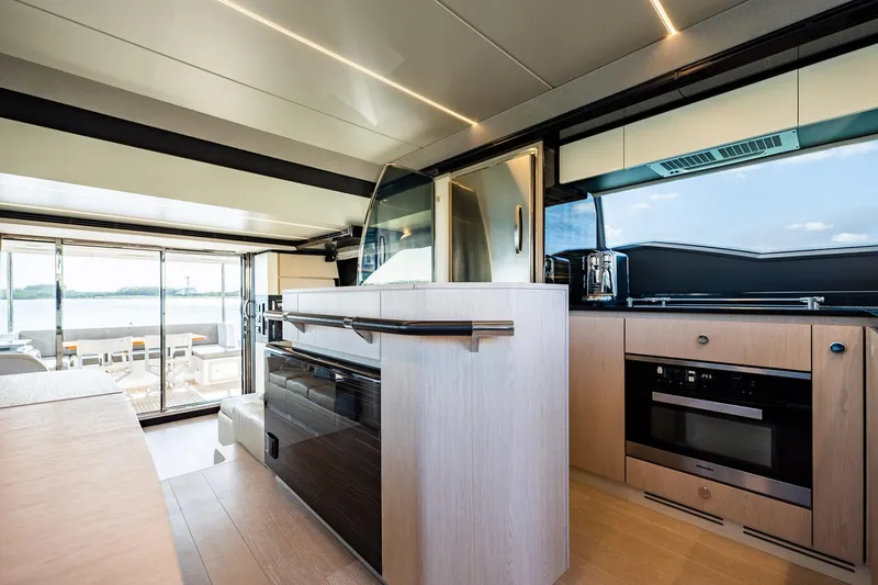 Slide: The Image of Luxurious interior of 2017 Azimut 66 yacht with modern kitchen and scenic views. - 13