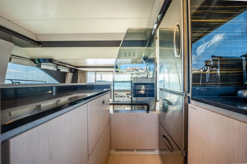 Slide: The Image of Luxurious interior of 2017 Azimut 66 yacht with modern kitchen and ocean view. - 16
