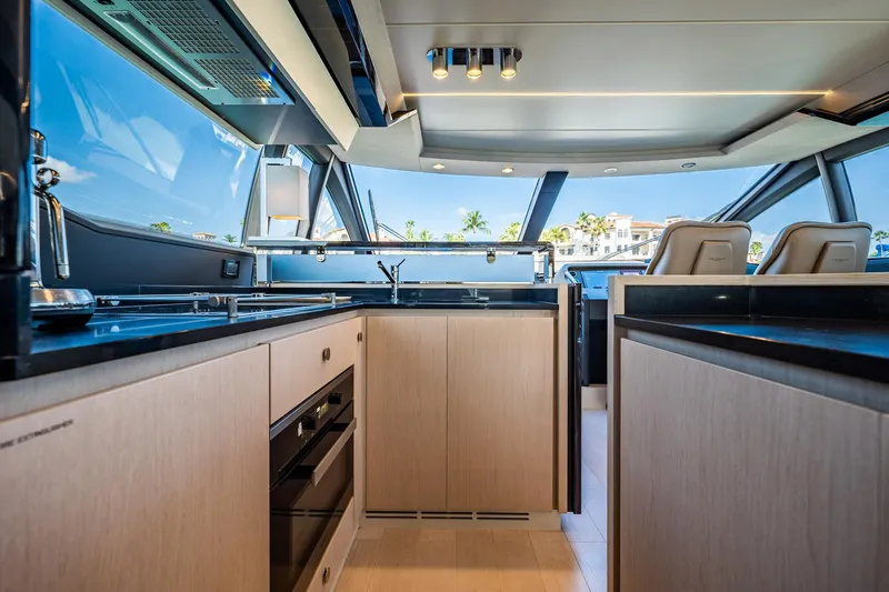 Slide: The Image of Luxurious interior of 2017 Azimut 66 yacht with modern kitchen and panoramic windows. - 18