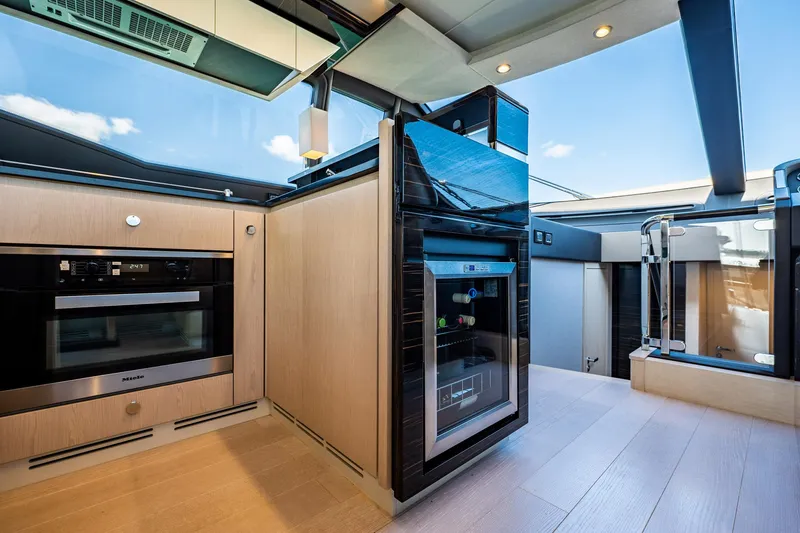 Slide: The Image of Luxurious interior of 2017 Azimut 66 yacht featuring modern kitchen appliances and sleek design. - 19