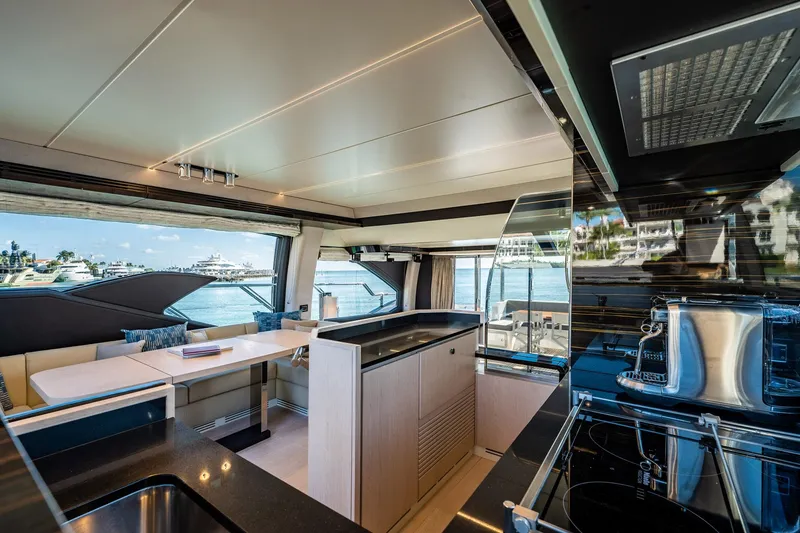 Slide: The Image of Luxurious interior of 2017 Azimut 66 yacht with modern kitchen and dining area. - 21