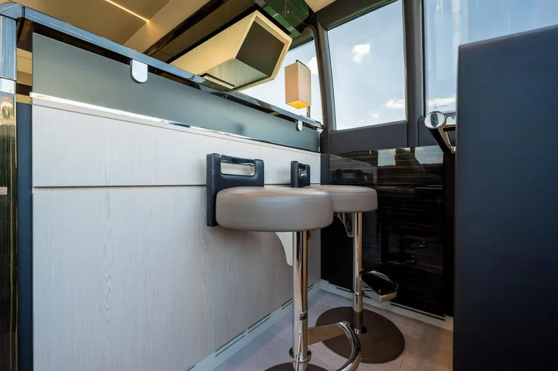 Slide: The Image of Modern interior of 2017 Azimut 66 yacht with sleek bar stools and stylish design. - 22