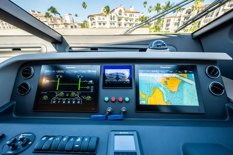 Slide: The Image of Control panel of a 2017 Azimut 66 yacht with navigation screens and controls. - 26