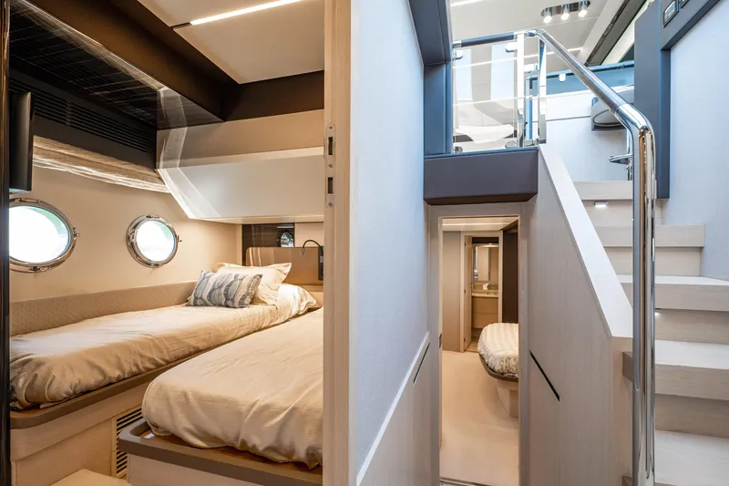 Slide: The Image of Luxurious interior of 2017 Azimut 66 yacht featuring cozy twin beds and modern design. - 28