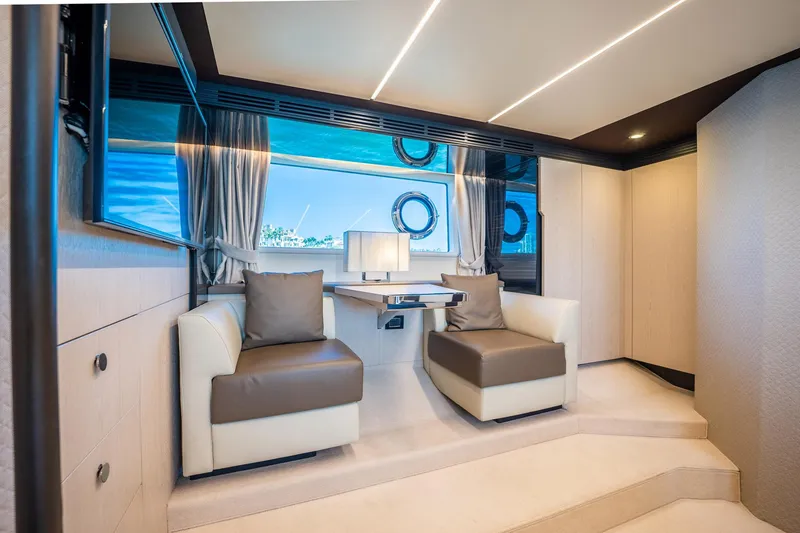 Slide: The Image of Luxurious interior of 2017 Azimut 66 yacht with modern seating and large windows. - 29