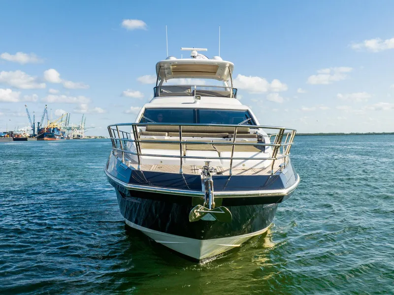 Slide: The Image of Azimut 66 yacht from 2017 on calm water under a clear blue sky. - 3