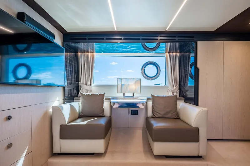 Slide: The Image of Luxurious interior of 2017 Azimut 66 yacht with modern seating and large windows. - 30