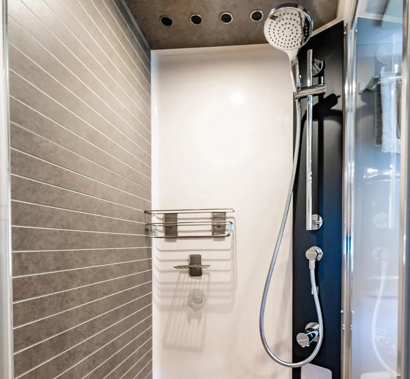 Slide: The Image of Modern shower in 2017 Azimut 66 yacht with sleek fixtures and tiled walls. - 34