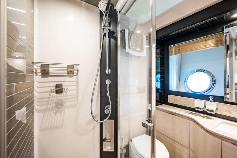 Slide: The Image of Luxurious bathroom in 2017 Azimut 66 yacht with modern shower and porthole window. - 35