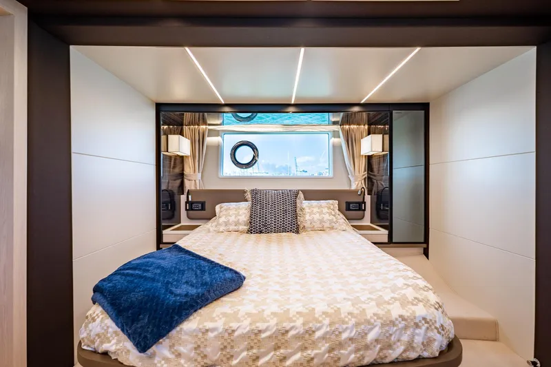 Slide: The Image of Luxurious bedroom interior of 2017 Azimut 66 yacht with elegant bedding and modern lighting. - 42