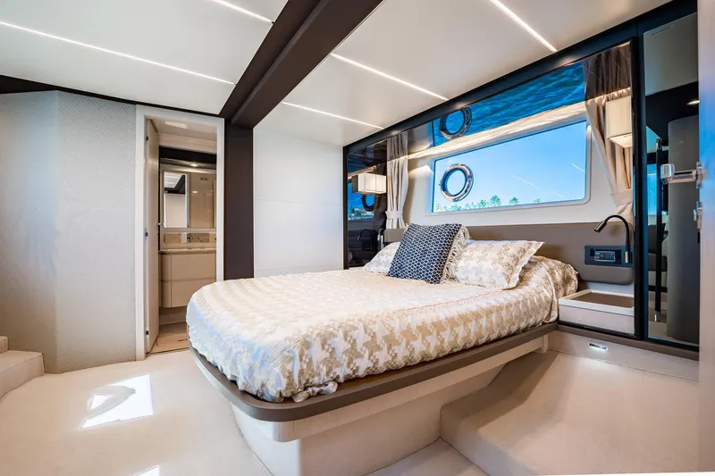 Slide: The Image of Luxurious bedroom interior of 2017 Azimut 66 yacht with elegant decor and large window. - 43